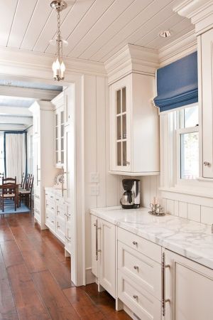 beautiful kitchen with white cabinets white marble wood floors.jpg